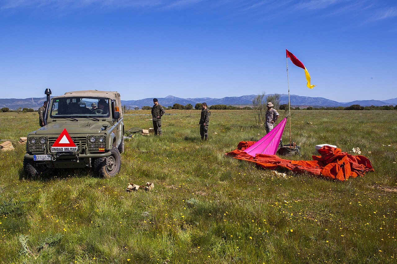Special Operations Aníbal — Soldiers of the Spanish Brigada Paracaidista recover a soft-top Aníbal (ET 113125) beside its parachutes after an airborne cargo drop, Operation Skyfall - España, May 2015. Airborne rather than special-operations use